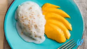 Rice porridge with coconut milk and mango slices.